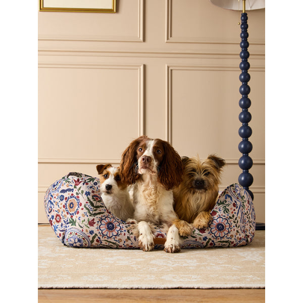 Dogs laying on Joules Festival Floral Box Bed