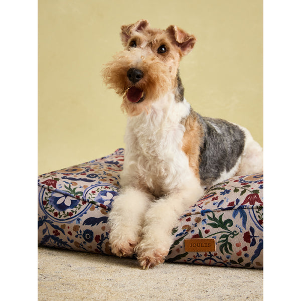 Fox Terrier laying on Joules Festival Floral Mattress