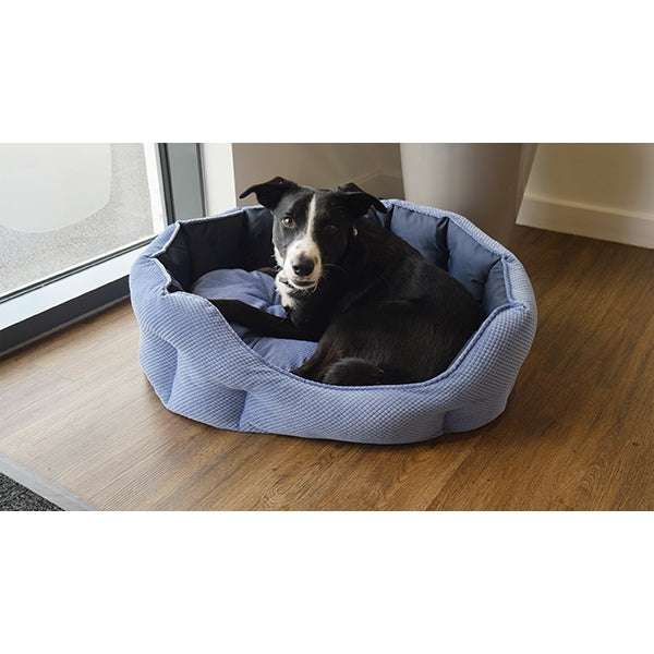 Dog laying in Quilted Navy Water Resistant Bed