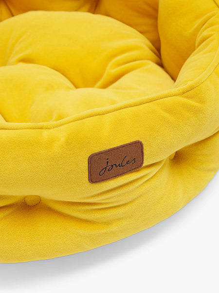 Close up of front detailing of Joules Chesterfield Pet Bed in yellow