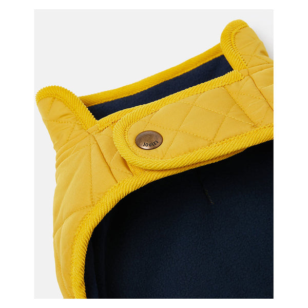 Close up of chest fastening of Joules Quilted Dog Coat in Antique Gold